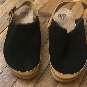 Woman’s 9 Reef Black Suede with Tan Leather Backstrap Clogs